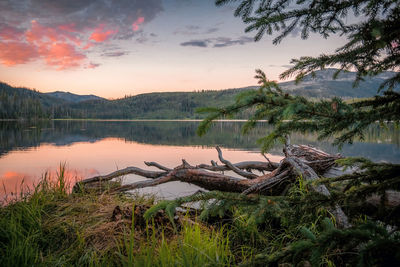 Scenic view of lake against sky during sunset