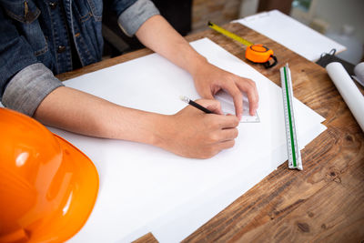 High angle view of man working on table
