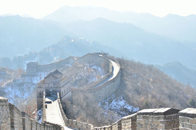 Scenic view of great wall of china and mountains