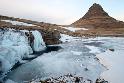 Scenic view of snowcapped mountains against sky during winter, iceland