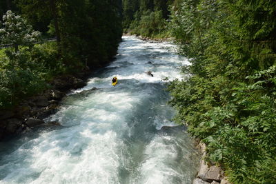 High angle view of man in caiacque in river