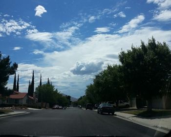 Cars on road against sky