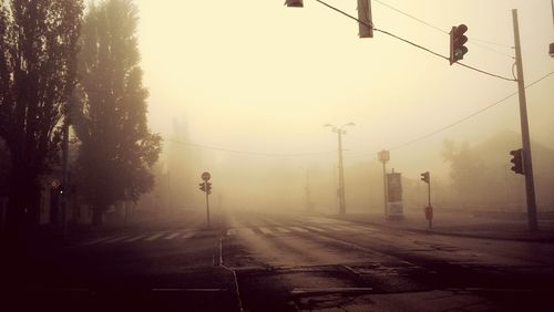 Road passing through foggy weather