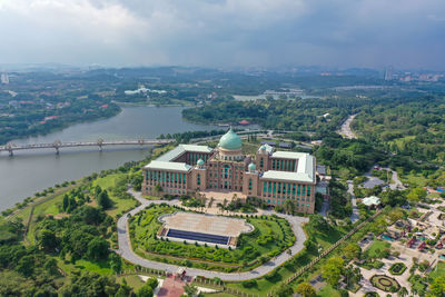 High angle view of buildings and trees against sky