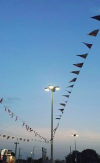 Low angle view of birds against clear sky