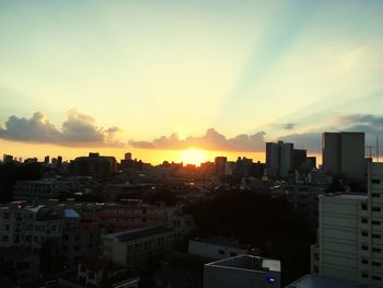 High angle view of buildings against sky during sunset