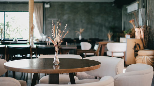 Empty chairs and tables in restaurant