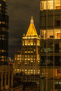 Illuminated buildings in city at night