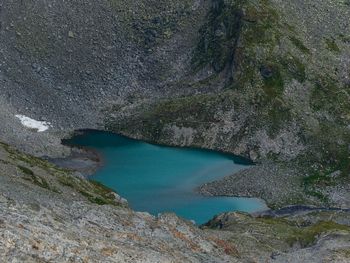 High angle view of water flowing through rocks