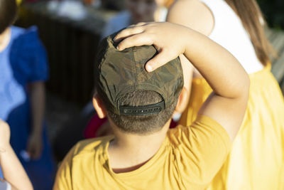 Close-up of boy wearing hat