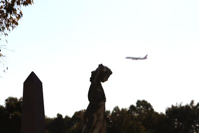 Low angle view of statue against clear sky