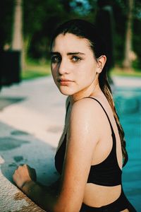 Portrait of young woman in swimming pool