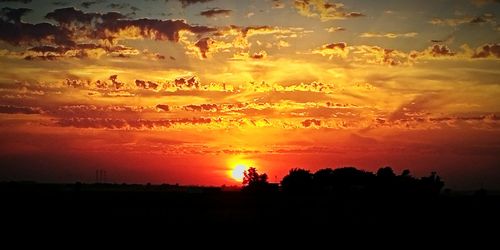 Scenic view of dramatic sky during sunset