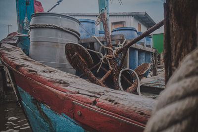 Close-up of old boat moored at harbor