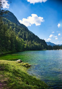 Scenic view of lake and mountains against sky