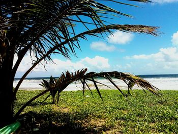 Scenic view of sea against cloudy sky