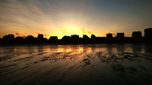 Silhouette of city at sunset