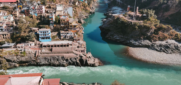 High angle view of buildings by sea