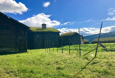 House on field against sky