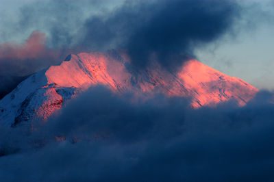 Scenic view of mountains against sky at sunset