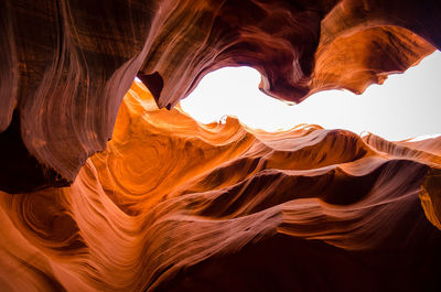 Low angle view of rock formation against sky