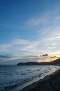 Scenic view of beach against sky during sunset