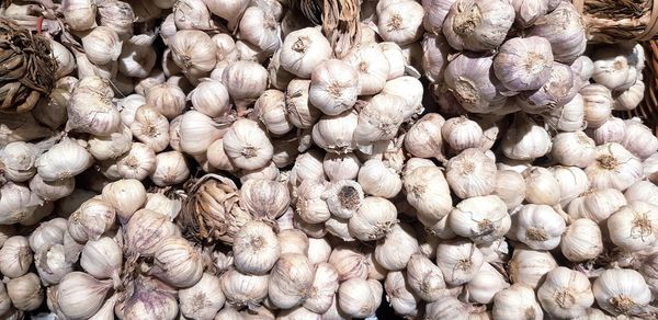 Full frame shot of garlics for sale in market