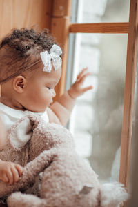 Cute baby girl looking away