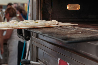 Close-up of person preparing food in kitchen