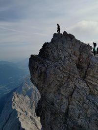 Rock formations on mountain against sky