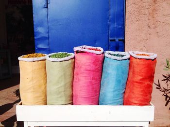 Close-up of multi colored candies against wall