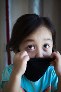 Close-up of girl wearing mask