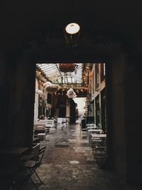 Illuminated pendant lights hanging in old building