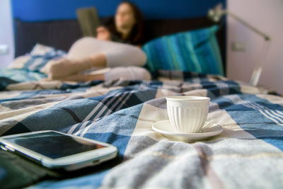 Close-up of woman relaxing on table