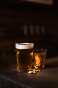 Glass of beer on table