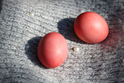 Pink easter eggs on a gray background