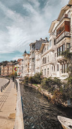 Buildings in city against sky