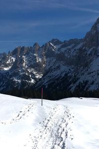 Snow covered mountains against sky