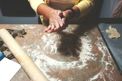 Midsection of person making cookie