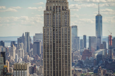 Modern buildings in city against sky