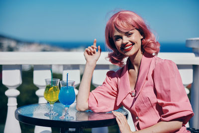 Young woman drinking glass