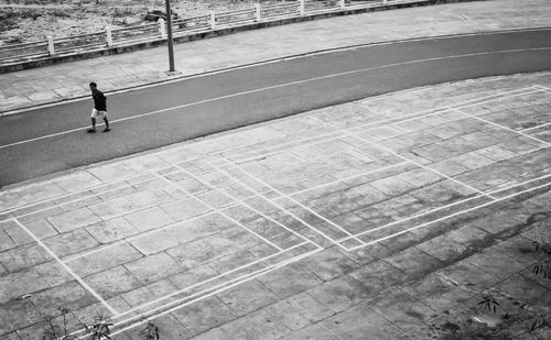 Woman walking on road