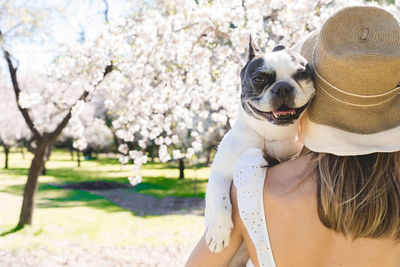 Rear view of woman with dog