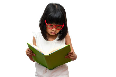 Woman holding book against white background