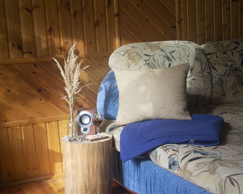 Close-up of mannequin on sofa at home