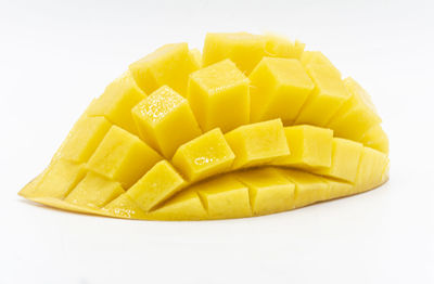 Close-up of chopped fruit against white background