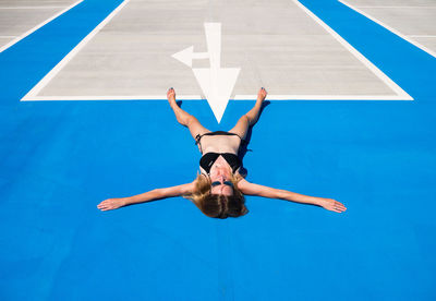 High angle view of woman against blue sky