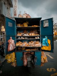 Man for sale at market stall