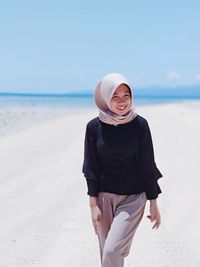 Full length of man standing on beach