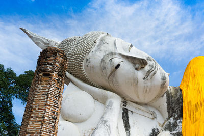 Low angle view of statue against sky